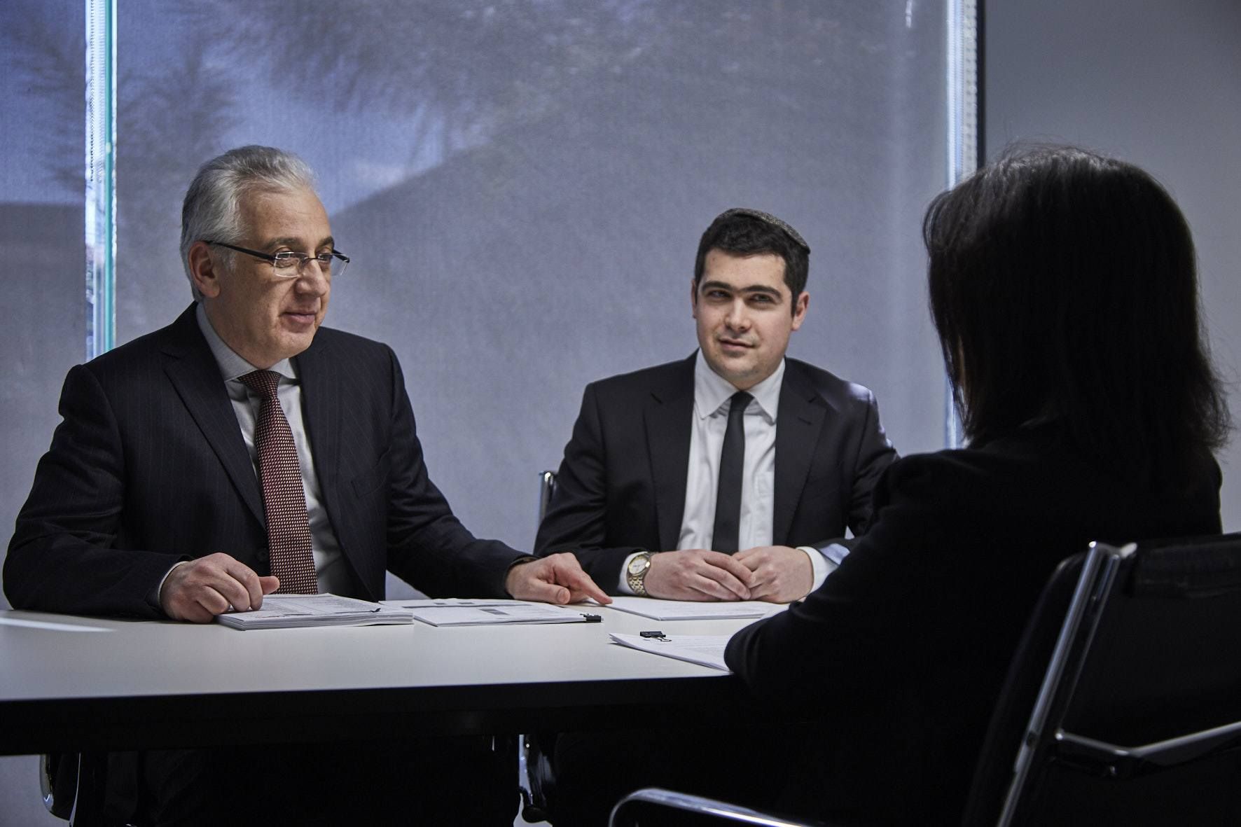 Leon Vilshansky, director of Green & Sternfeld, in a meeting with colleagues
