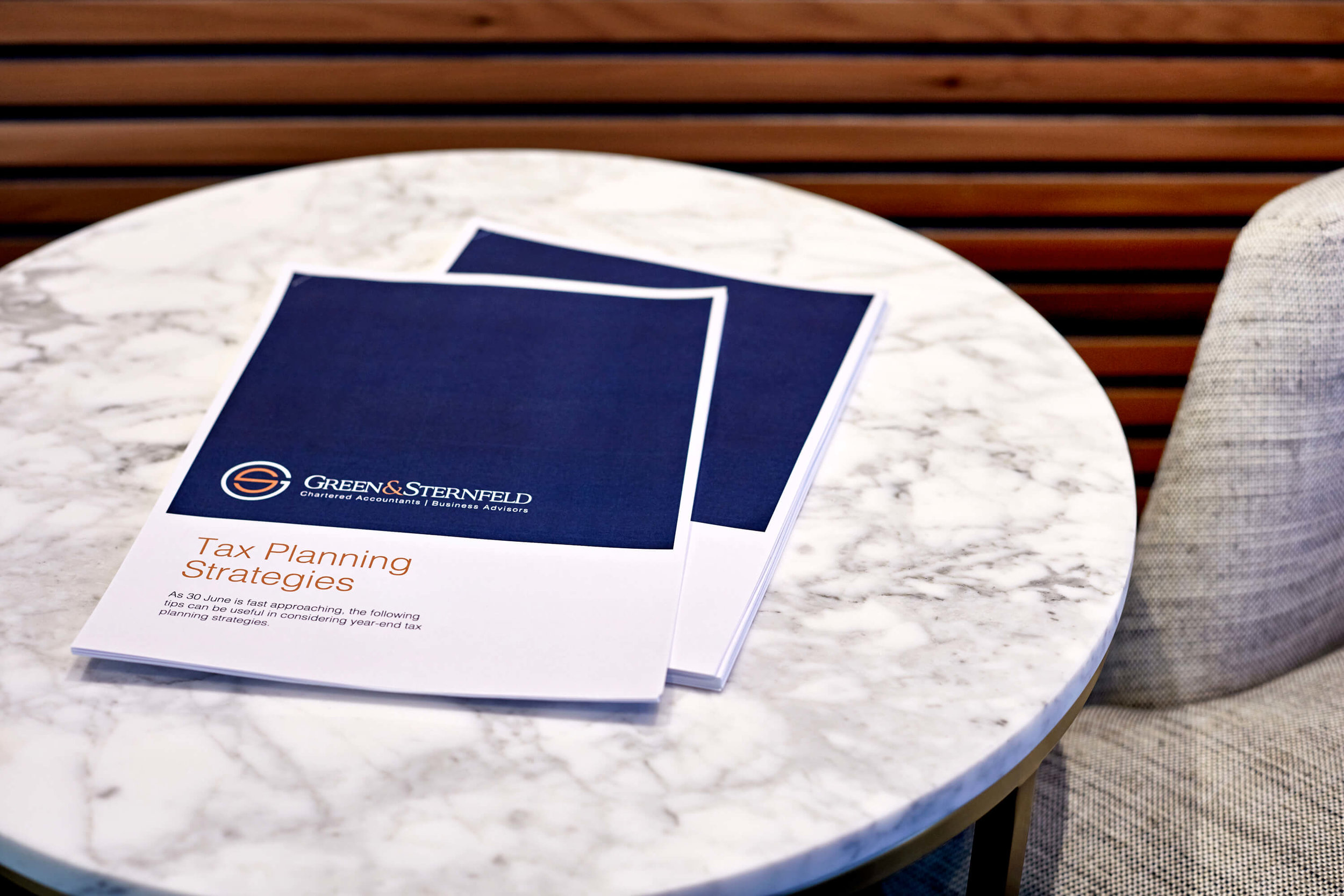 Green & Sternfeld Tax Planning Strategies papers on a marble table
